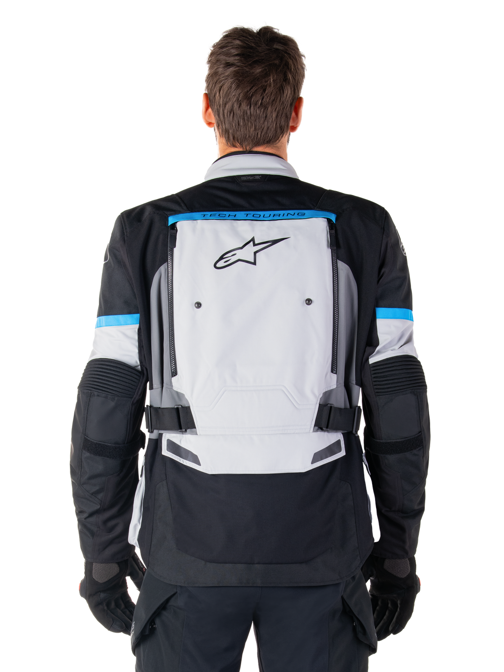 Alpinestars Bogota' Pro Drystar® Jas, adventure motorjas, Ice Gray Black en Cyan, achteraanzicht met een groot lichtgrijs paneel met zwart sterlogo, cyaan accenten met Tech Touring-branding en verstelbare taillebanden