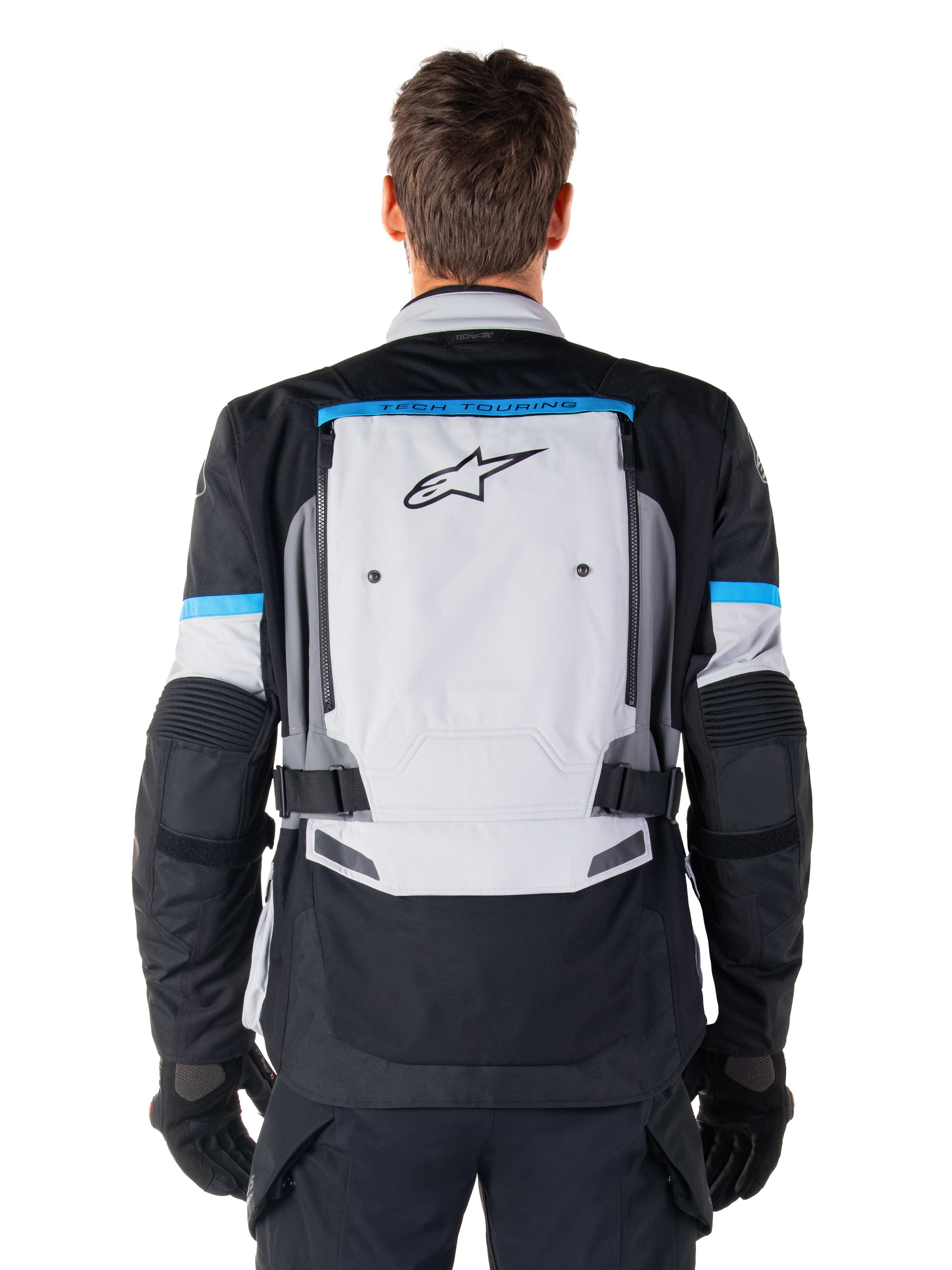 Alpinestars Bogota' Pro Drystar® Jas, adventure motorjas, Ice Gray Black en Cyan, achteraanzicht met een groot lichtgrijs paneel met zwart sterlogo, cyaan accenten met Tech Touring-branding en verstelbare taillebanden