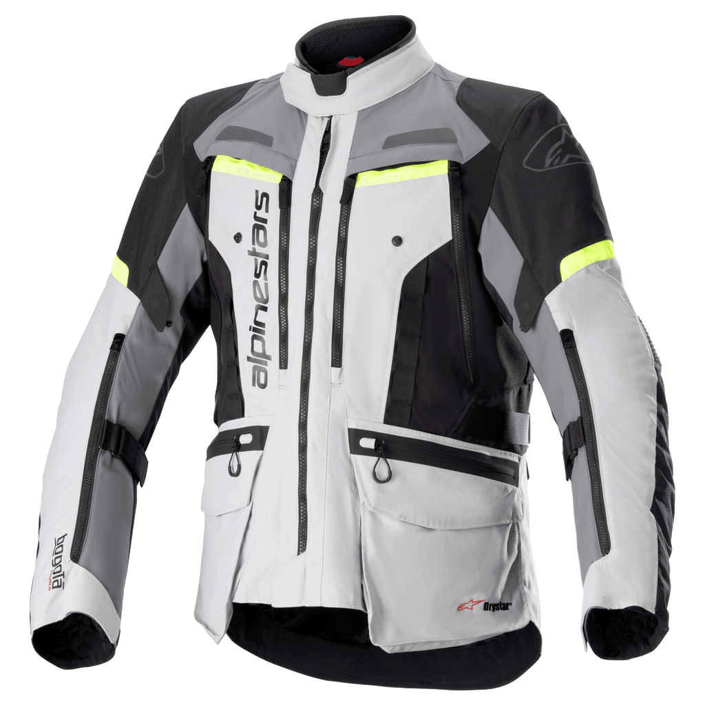Alpinestars Bogota Pro Drystar motorjas, adventure touring motorjas, ijsgrijs en donkergrijs met zwarte panelen en fluor gele accenten, voorzien van meerdere cargozakken en ventilatieritsen, duurzaam waterdicht textielontwerp voor alle weersomstandigheden