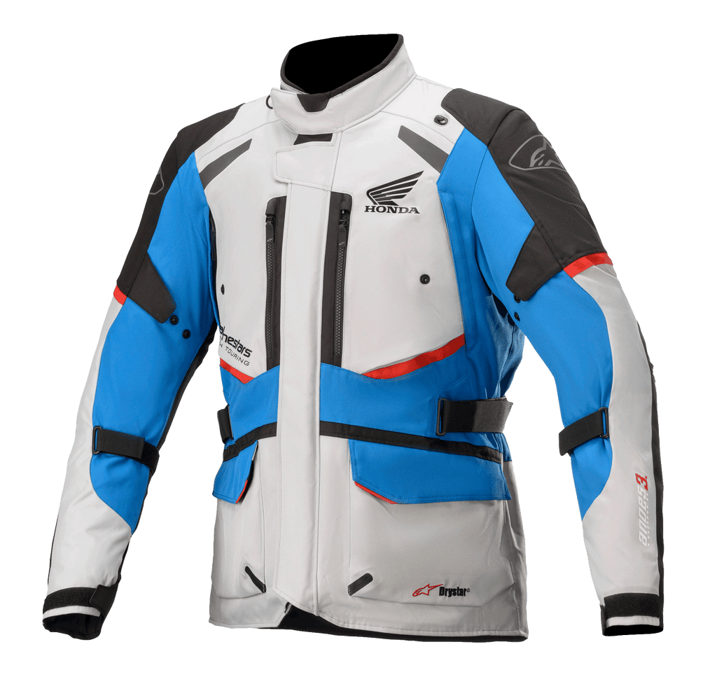Alpinestars Honda Andes V3 Drystar® jas, touring motorjas, ijsgrijs, blauw en felrood, waterdicht ontwerp met hoge kraag, meerdere ventilatieopeningen met rits, cargozakken en verstelbare riemen, voorzien van Honda-branding