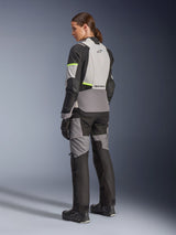 Alpinestars Woman Stella Andes V4 Drystar® Jacket, Adventure-Touring Motorcycle Jacket, Ice Gray and Dark Gray with Yellow Fluo accents, back view on a model wearing matching textile pants, featuring waterproof construction and reinforced ripstop panels.