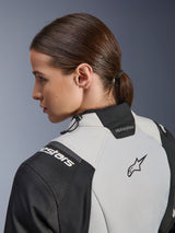 Alpinestars Woman Stella Andes V4 Drystar® Jacket, Adventure Touring Jacket, Ice Gray and Black, close-up rear profile showing the high collar with drawstring adjustment, Alpinestars branding on the shoulder, and Astars logo on the back