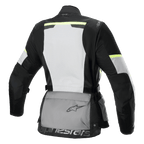 Alpinestars Stella Andes Air Drystar® Jas, dames touring-motorjas, achteraanzicht, Ice Gray, donkergrijs en zwart, voorzien van een groot wit mesh rugpaneel, grijze opbergzak op de rug met logo, gele hi-viz accenten en een textielconstructie voor luchtstroom en bescherming.