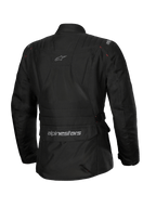 Alpinestars Stella ST-1 Waterproof jas, dames motorjas, zwart, achteraanzicht met een grote cargozak op de onderrug met logo, adventure touring-ontwerp met subtiele branding op de bovenrug, duurzame waterdichte textielconstructie.