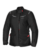 Alpinestars Stella ST-1 Waterproof Jacket, dames motorjas, zwart met rode accenten, hoge kraag, ritssluiting aan de voorzijde, grote cargozakken in de taille, verstelbare taille- en manchetbanden, weerbestendige constructie