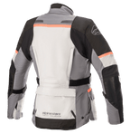 Alpinestars Stella Andes V3 Drystar® damesjas, motorjas, Ice Gray, Dark Gray, zwart en koraalrood, achteraanzicht met een grote opbergzak op de onderrug, verstelbare tailleband en koraalrode accenten op de schouders en rug.