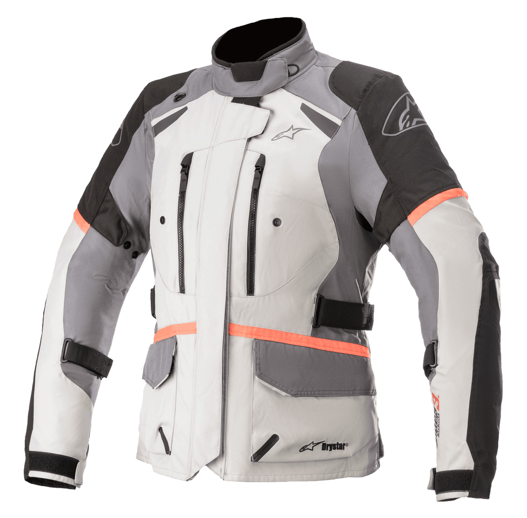 Alpinestars Stella Andes V3 Drystar motorjas voor dames, motor touringjas, lichtgrijs met donkergrijze en zwarte panelen, felle koraalrode accenten, borstventilatie met ritssluiting, grote klepzakken en verstelbare taillebanden, technische textielconstructie voor adventure-rijden in alle weersomstandigheden