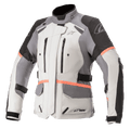 Alpinestars Stella Andes V3 Drystar motorjas voor dames, motor touringjas, lichtgrijs met donkergrijze en zwarte panelen, felle koraalrode accenten, borstventilatie met ritssluiting, grote klepzakken en verstelbare taillebanden, technische textielconstructie voor adventure-rijden in alle weersomstandigheden