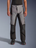 Alpinestars Andes V4 Drystar® Pants, Motorcycle Adventure Touring Pants, Gray and Black, front view worn by a model with black riding boots, featuring reinforced knee patches and thigh cargo pockets, waterproof breathable textile construction for all-weather riding