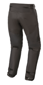 Alpinestars Raider V2 Drystar® broek, textiele motorbroek, zwart, achteraanzicht met verbindingsrits in de taille en verstelbare klittenbandsluitingen op de achterkant van de benen en enkels.