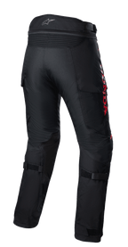 Alpinestars Honda Bogota' Pro Drystar® broek, adventure motorbroek, zwart met rode HONDA-branding, achteraanzicht met accordeon stretchpanelen bij de taille, verstelbare bandjes op de kuiten en duurzame textielconstructie voor multi-seizoen adventure ritten.