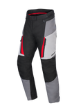 Alpinestars Honda Stella ST-1 waterdichte motorbroek voor dames, motor touringbroek, Ice Gray, Dark Gray en zwart met rode accenten, voorzien van cargozakken met ritssluiting, ergonomische textielconstructie en verstelbare taille.