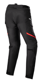Alpinestars Stella Honda Andes V3 Drystar® damesbroek, motor toerbroek, zwart en felrood, achteraanzicht met cargozakken, verstelbare taille- en kniebanden en duurzame textielconstructie voor rijden in alle weersomstandigheden