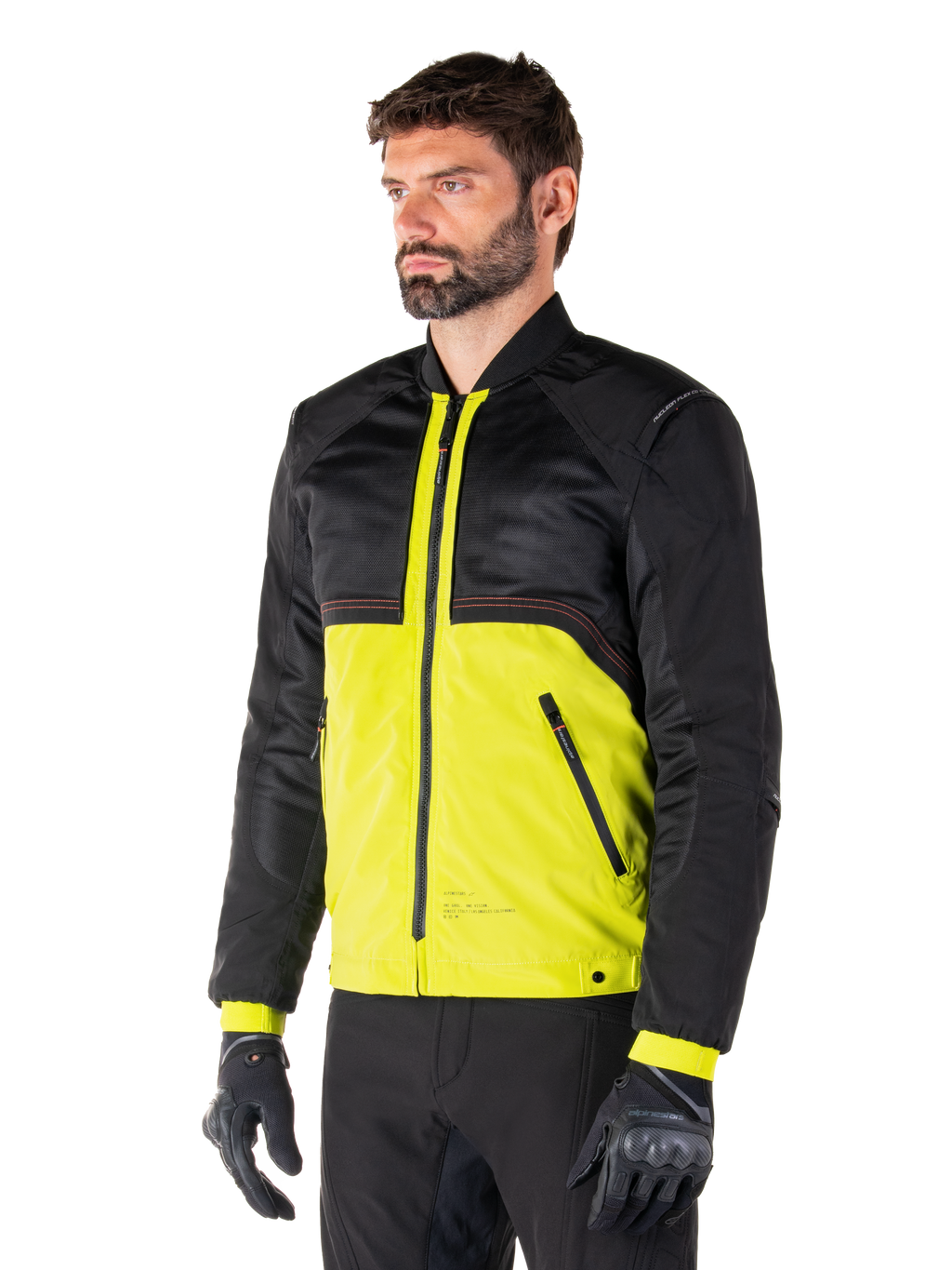 Alpinestars Mootant Waterproof Parka in Lime Punch Black, modulaire motorjas met een zwart mesh bovenstuk en een opvallend limoengroen onderstuk, gedragen door een mannelijke motorrijder met zwarte handschoenen en broek, urban contemporary rijstijl.