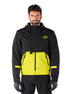 Alpinestars Mootant Waterproof Parka, motorjas voor touring, Lime Punch en zwart, tweekleurig ontwerp met capuchon, felgele onderkant en zwart bovenstuk, gele mouwbandjes, logo op de borst, technische modulaire stijl