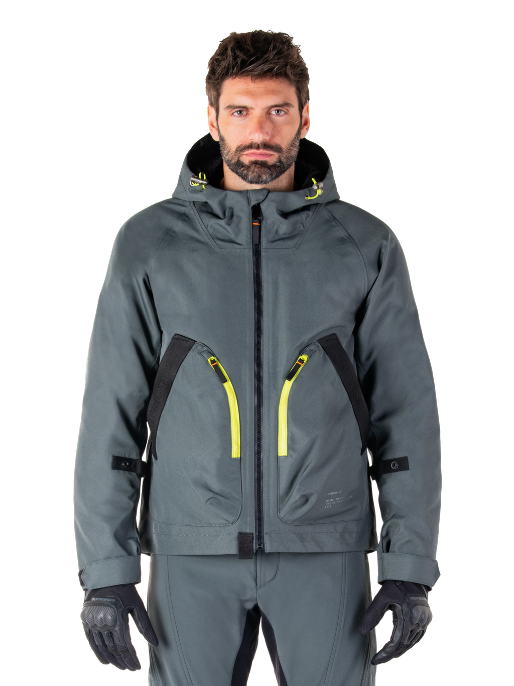 Alpinestars Morush Waterproof Parka, urban grijze motorjas, felgele ritsen en zwarte accenten, ontwerp met capuchon en grote voorzakken, technische streetwear-geïnspireerde styling
