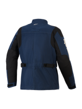 Alpinestars Dice Jacket, urban motorjas, donkerblauw en zwart, achteraanzicht met veldjas-styling, verstelbare taillebanden, zwarte schouder- en elleboogversterkingspanelen, en een klein wit logo op de kraag.