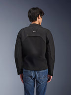 Alpinestars Provoke Jacket, Urban Motorcycle Jacket, Black, rear view showing white Astars logo and technical ripstop panels, worn with blue denim jeans, contemporary design for city commuting