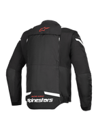 Alpinestars T-Stunt Air jas, achteraanzicht, zwart en wit, met een rood sterlogo op de nek, witte branding op de onderrug en verticale ritsen voor het modulaire luchtstroomsysteem.