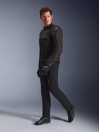 Alpinestars SMX Air Jacket in Black Anthracite, worn by model with matching black riding pants, gloves, and shoes, studio full-body shot, performance sport motorcycle gear featuring tech mesh and shoulder sliders