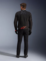 Alpinestars SMX Air Jacket, Black with Bright Red logo, Rear view showing Tech-Air Ready branding and mesh ventilation panels, worn with black pants and gloves, high-performance sport and racing motorcycle gear