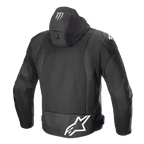 Alpinestars FQ20 Zaca Air Monster jas, textiele motorjas, zwart en wit, achteraanzicht met groot wit Alpinestars-logo op de onderrug, Monster Energy claw-logo op de capuchon, 3D-mesh ventilatiepanelen en DFS Lite schouder-sliders.