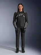 Alpinestars Stella T-Sps Air V2 Jacket, Women's Motorcycle Jacket, Black and White, featuring mesh panels and white accents, worn with black pants, gloves, and boots, athletic fit for urban riding