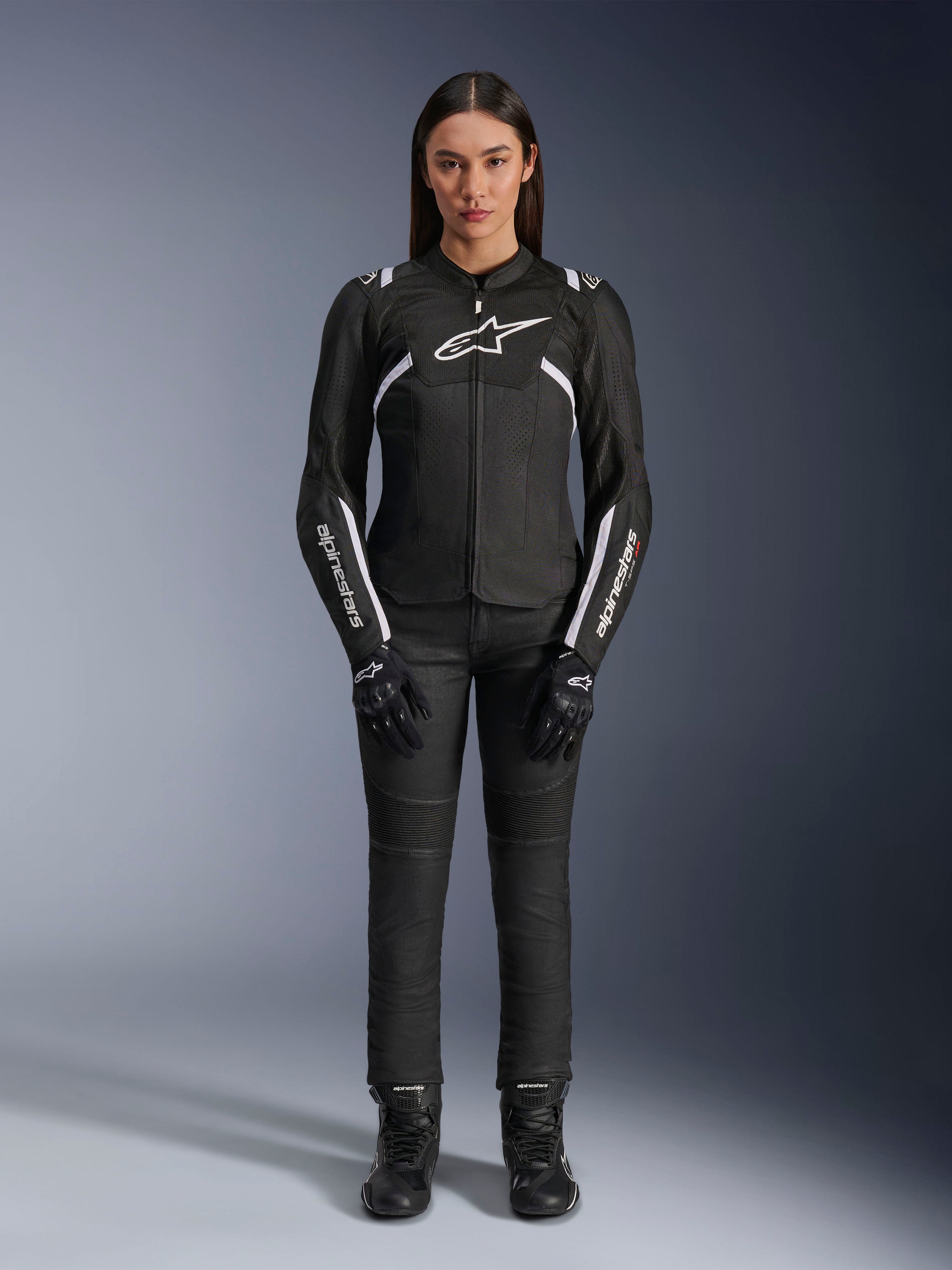 Alpinestars Stella T-Sps Air V2 Jacket, Women's Motorcycle Jacket, Black and White, featuring mesh panels and white accents, worn with black pants, gloves, and boots, athletic fit for urban riding