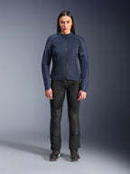 Woman model wearing Alpinestars Stella C-1 Air Jacket in Blue, urban motorcycle jacket with tech mesh panels, paired with black riding pants and black sneakers, studio front view