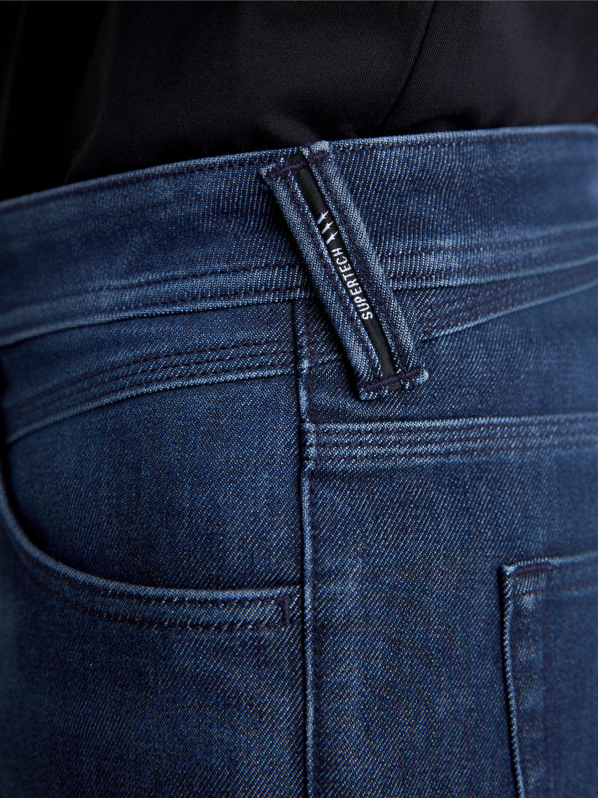 Alpinestars Flex-AST 10 Tough Max Denim Pants, men's motorcycle denim pants in dark blue, close-up view of the belt loop and pocket details showing single-layer technical denim construction and branded trim