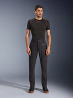 Alpinestars Flex-AST Canvas Pants, Urban Motorcycle Pants, Black, worn by a model with a black short-sleeved base layer featuring red stitching and black casual sneakers, highlighting the front zippered pockets and ergonomic canvas design.