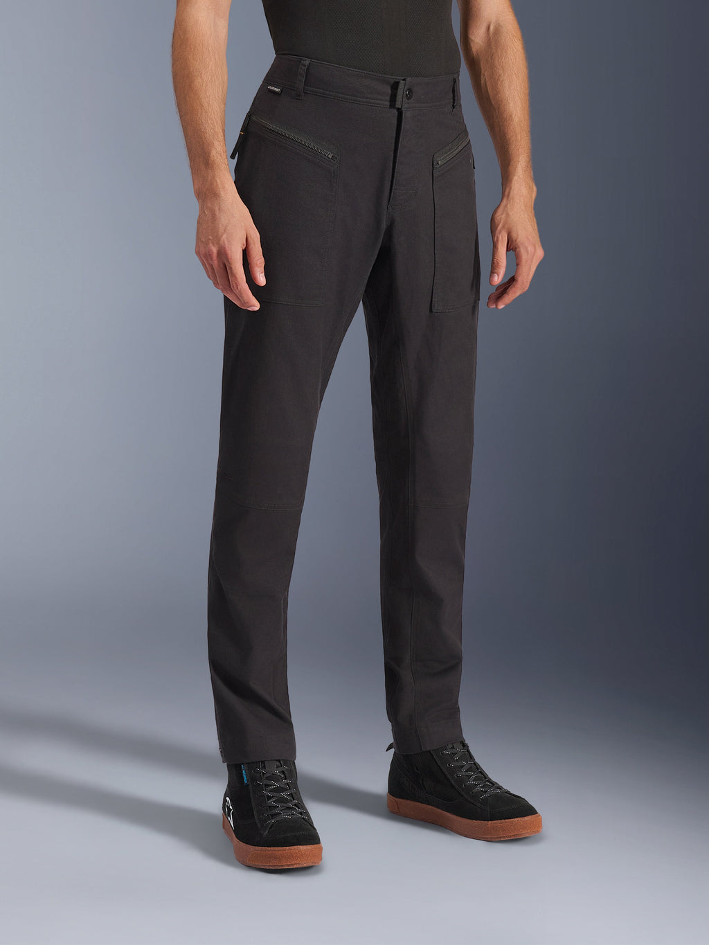 Alpinestars Flex-AST Canvas Pants, Black, Urban Motorcycle Pants, worn on model with black sneakers, featuring a heritage workwear design, stretch polycotton twill fabric, and functional zippered front pockets.