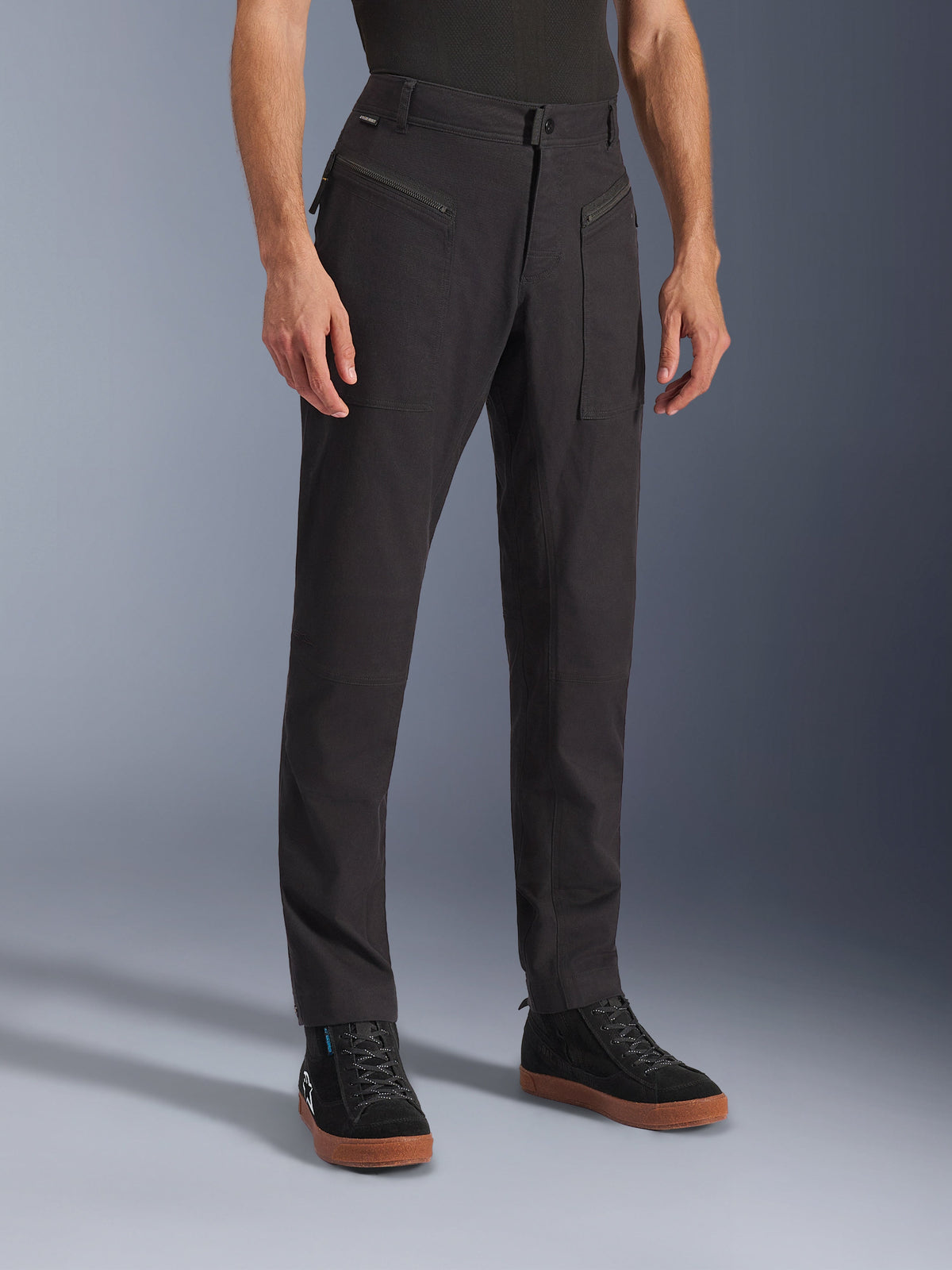 Alpinestars Flex-AST Canvas Pants, Black, Urban Motorcycle Pants, worn on model with black sneakers, featuring a heritage workwear design, stretch polycotton twill fabric, and functional zippered front pockets.