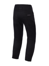 Alpinestars Flex-AST Canvas Pants, zwart, achteraanzicht, motorbroek in klassieke werkkledingstijl met Alpinestars-logo op de achterzak, contrasterende decoratieve siernaden en verstelbare drukknopen aan de broekspijpzoom