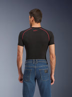 Alpinestars Flex-AST 5 Denim Pants - Short, Indigo Washed blauwe motorjeans, achteraanzicht met achterzakken en een klein zwart Alpinestars-label, gedragen met een zwart compressieshirt met rode stiksels, casual urban motorkleding.