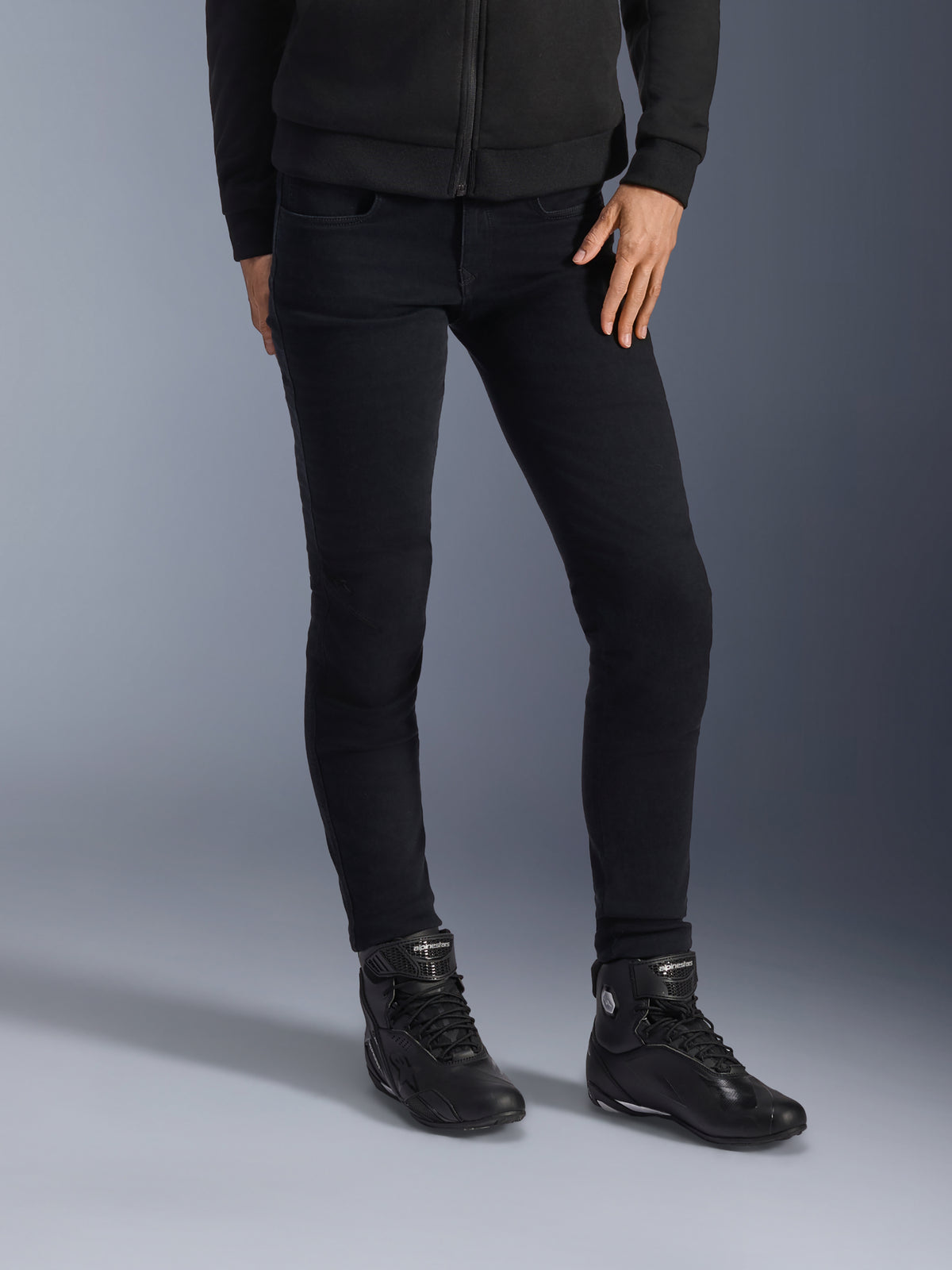 Alpinestars Daisy V3 Women's Riding Denim, Rinse Black, slim-fit motorcycle jeans, paired with black high-top riding boots and zip-up hoodie, sleek monochrome urban styling