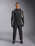 Alpinestars Limited Edition Lamborghini GP Tech V4 Suit FIA, professional auto racing suit, Black with Silver and Gold accents, featuring Automobili Lamborghini Squadra Corse logo on chest, worn with matching racing gloves and boots, sleek athletic design for circuit competition