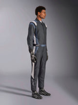 Alpinestars GP Pro Comp V2 FIA Suit, Auto Racing Suit, Black Asphalt and White, worn by a model with matching racing gloves and shoes, side profile view, professional motorsport gear with Alpinestars branding