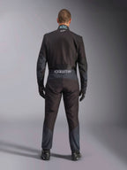 Alpinestars KMX-5 V3 Suit, Karting Suit, Black and Dark Shadow, back view of a driver wearing the full racing suit with matching gloves and shoes, featuring Alpinestars branding on the waistband and ergonomic paneling.