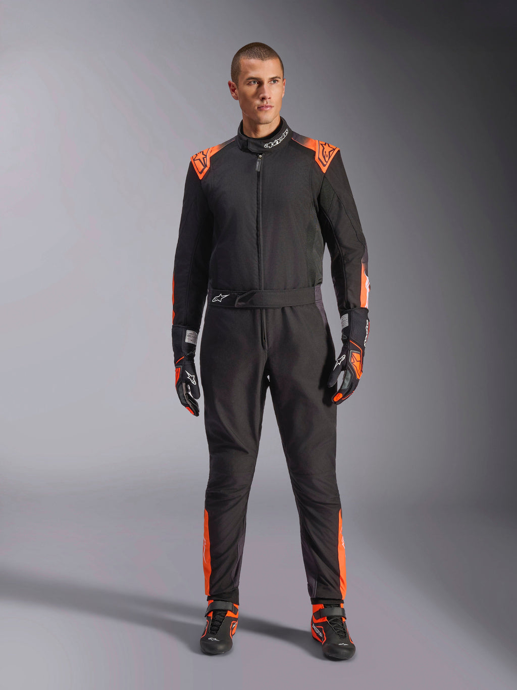 Alpinestars KMX-5 V3 Pak, eendelig herenkartpak, zwart en fluo oranje, FIA 8877-2022 Grade 1 gecertificeerd.