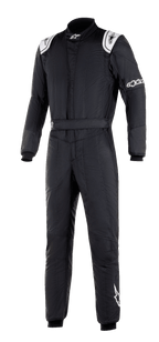 Alpinestars GP Tech V3 Suit FIA, Black Auto Racing Suit, featuring white shoulder panels with logos, high collar, and Alpinestars branding on the sleeve and leg, professional motorsport gear with a technical panelled design