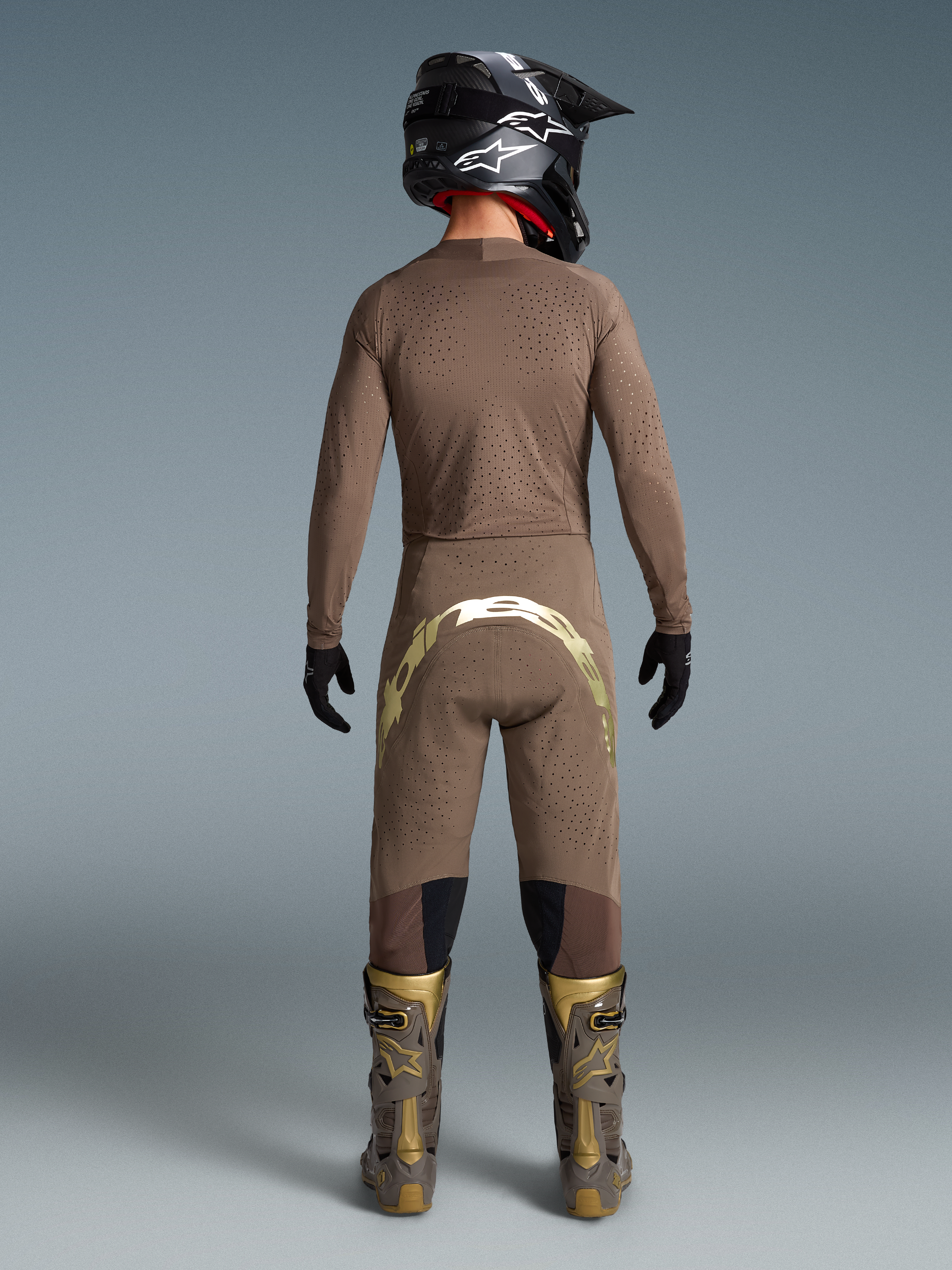 Alpinestars Limited Edition Supertech Air Gold Gear Set, men's Earth Brown and gold ventilated motocross outfit, back view.