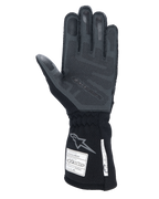Alpinestars Tech-1 ZX V4 Gloves, Black Anthracite, palm view featuring textured 3D silicone grip, long cuff with FIA and SFI safety certification labels, professional auto racing gloves