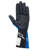 Alpinestars Tech-1 Start V4 FIA-handschoenen, autoracehandschoenen, koningsblauw en zwart, handpalmaanzicht met grijs siliconen grippatroon op de vingers en handpalm, verlengde manchet met wit logo en FIA-homologatielabel