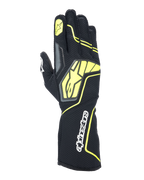 Alpinestars Tech-1 KX V4 handschoenen, kartinghandschoenen, Tar Gray, zwart en fluogeel, bovenaanzicht met ademende mesh-constructie, groot geel Alpinestars-logo, wit woordmerk op de pols, gele ster op de wijsvinger, modern sportief design