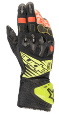 Alpinestars GP Tech V2 handschoenen, motorracehandschoenen, zwart met fluogeel en rode accenten, voorzien van harde knokkelbescherming, geperforeerde leren manchet met DFS-branding en accordeon stretchpanelen voor optimale flexibiliteit.