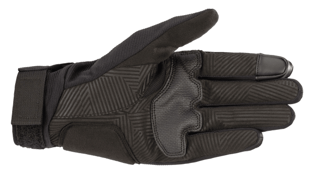 The Reef Gloves from Alpinestars EU are black and feature the Alpinestars logo and branding in white on the backhand. Designed for motorsport or outdoor activities, these gloves have a sleek design, stretch fabric for flexibility, and reinforced stitching.