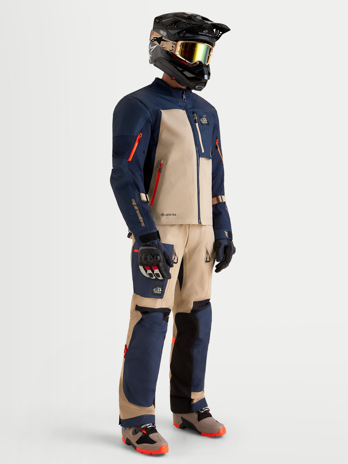 Alpinestars Arenis Gore-Tex Jacket, men's adventure touring motorcycle jacket in night navy and aluminum, worn by a rider in full matching gear with helmet, goggles, and gloves.