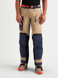 Alpinestars Arenis Gore-Tex Pants, men's adventure touring motorcycle pants in night navy, aluminum, and tan, front view on a model showing waterproof textile construction, thigh ventilation, and cargo pocket.