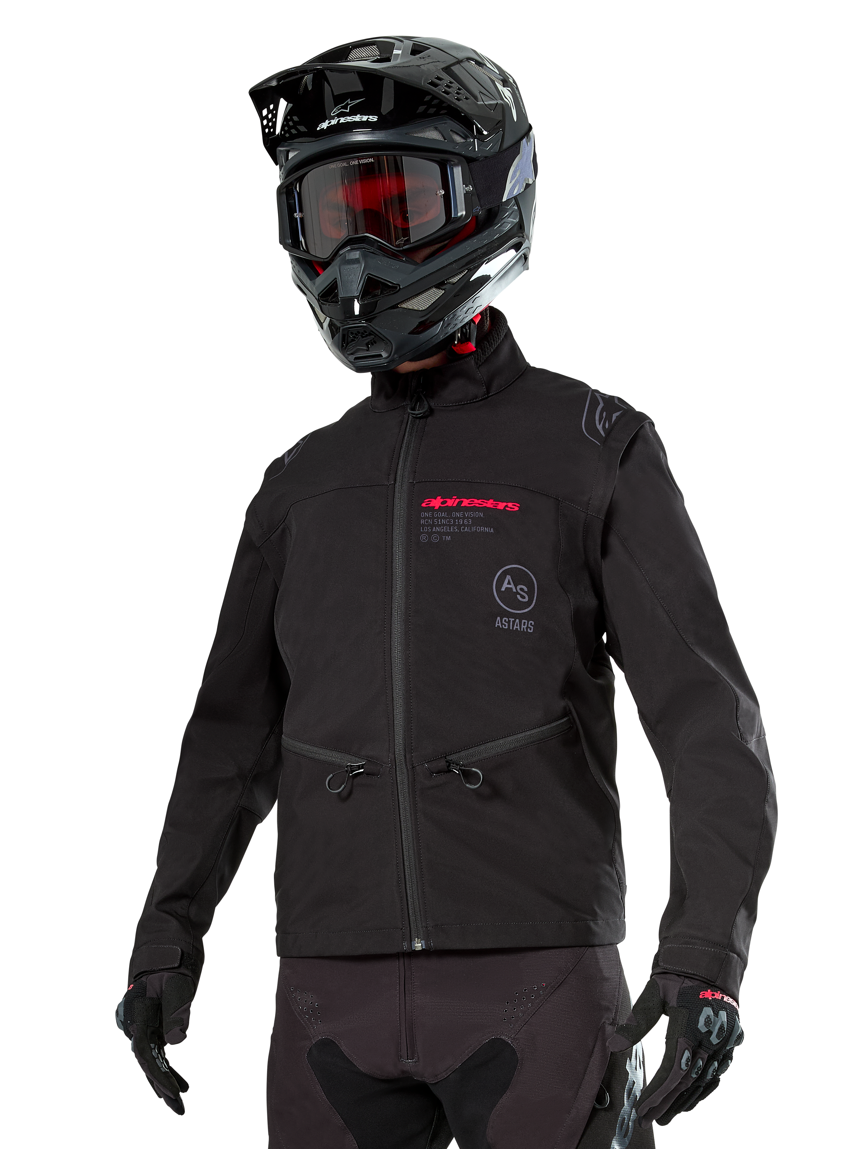 Alpinestars Lite-Dura Softshell Jacket, Black off-road motorcycle jacket with red branding and AS logo, worn with a black motocross helmet, red goggles, and black gloves, featuring zippered hand pockets and adjustable cuffs, designed for enduro riding.